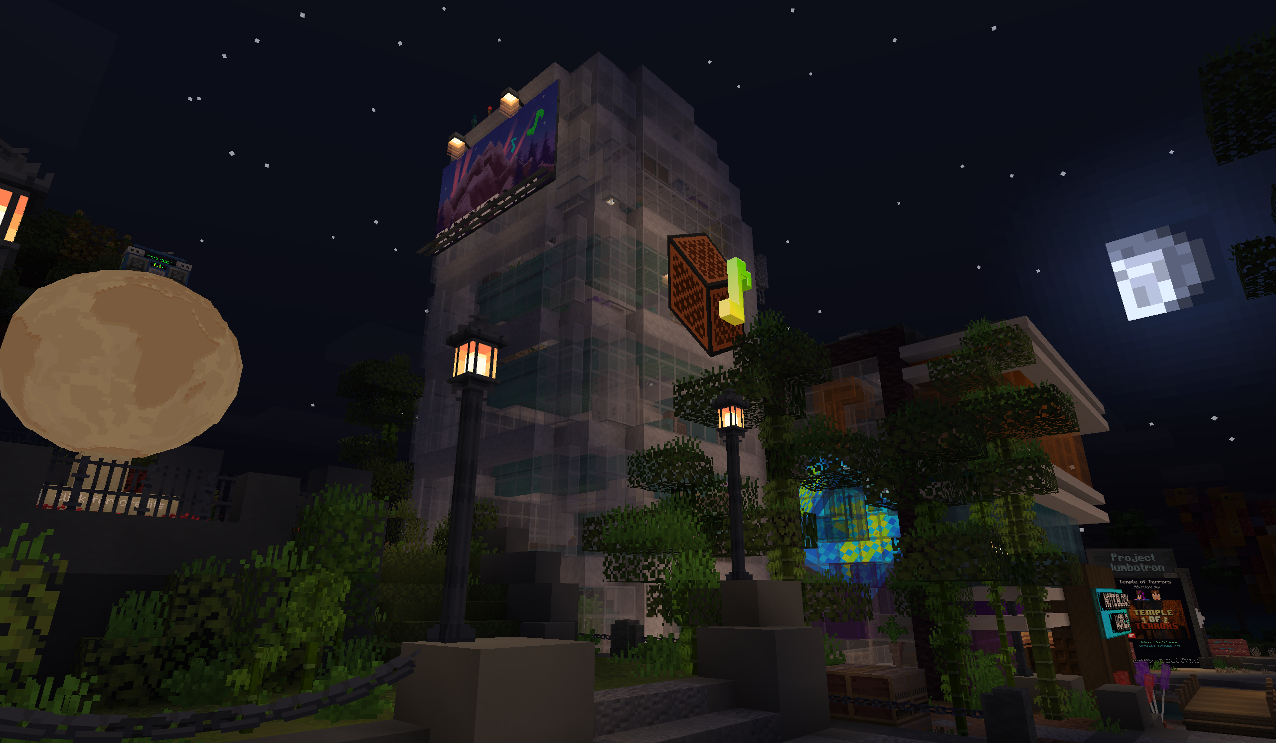 OpenNBS booth at night, with a glowing moon monument, lit Note Block Studio and Note Block World buildings, and a starry sky.